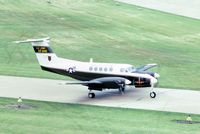 77-22940 @ DPA - C-12A taxiing by the tower.  Became C-12C, then to the State of New Mexico as N48JA