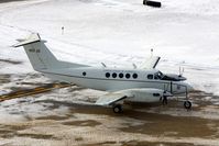 94-0320 @ CID - C-12R taxiing by the control tower