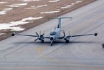 92-13121 @ CID - RC-12P taxiing in off runway 9