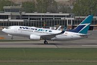 C-FGWJ @ YLW - West Jet B737-700 - by Andy Graf-VAP