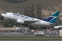 C-GWSI @ YLW - West Jet B737-600 - by Andy Graf-VAP