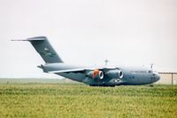 99-0058 @ CID - C-17A parked on taxiway C, 3/4 mile from photographer