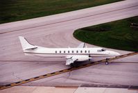 91-0513 @ CID - C-26B taxiing past the control tower. - by Glenn E. Chatfield
