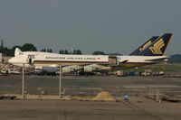 9V-SFL @ BRU - apron of BRUCARGO - by Daniel Vanderauwera