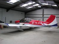 G-ILUA @ EGBT - Alpha R2160 in the hangar at Turweston
