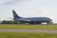 N505AU @ MHT - landing on runway 35 - by John Newall