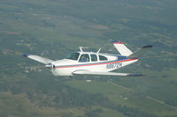 N8672M - Bonanza Somewhere over Florida - by Kevin Roseberry