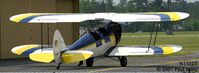 N1322T @ SFQ - Nestled between the hangars - by Paul Perry