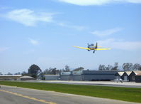 N4995C @ SZP - 1949 North American T-6G TEXAN 'Thirsty Girl', P&W R-1340 600 Hp, gear coming up. N110AM Moravan Zlin Z242L on taxiway. - by Doug Robertson