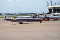 N521AE @ DFW - American Eagle N521AE taxiing in with Embraer a/c N617AE, N850AE and others in the background.
