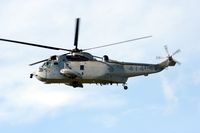 12414 @ ROCKCLIFF - C.A.F. Seaking flying over RockCliff Air Museum - by Dirk Fierens