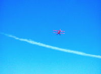 N6034S @ SZP - Christen PITTS S-2B, Lycoming AEIO-540 260 Hp, climbout from Rwy 22 above distant jet contrail - by Doug Robertson
