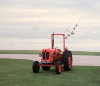 G-BRYA @ EGHE - yes, it is a four engined airliner behaving like that!  Dash Seven showing off, St Mary's Isles of Scilly September 1987 - by Pete Hughes