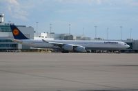 D-AIHD @ DEN - Lufthansa A340-600 taxiing on Alpha November.