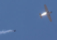 N2072K @ KFNL - Flyover with sky diver leaving the plane - by Bluedharma