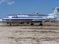 N1403M @ MHV - Retired by American following the 2001 terror attacks in the USA, most of American's Fokker 100s are in service with other airlines. On not so lucky aircraft N1403M sits in the baking sun at Mojave March 2003 - by Geoff Cook