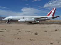 OB-R-765 @ MHV - Convair's entrants to the jetliner world were CV 880s and 990s. Although very attractive, and fast, both types were not the commercial success as hoped.  OB-R-765 (a CV990 Coronado) rests in faded APSA colours in the Mojave Desert - by Geoff Cook