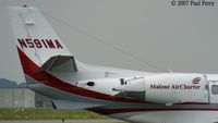 N591MA @ ECG - The finer points of her empennage...APU, nacelles, and the like