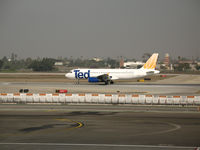 N467UA @ LAX - TED A320-232 rolling @ LAX - by Steve Nation