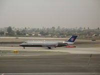 N932SW @ LAX - United Express CL-600-2B19 in old colors heading for active runway @ LAX - by Steve Nation