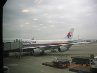 9M-MPF @ RCTP - Loading at Chaing Kia Shek for flight to Kuala Lumpur - by John J. Boling