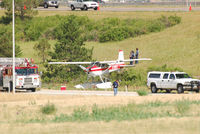 N78011 @ KAPA - Sitting at the field, saw this one land, Park at Tac-Air, and then take off about 45 minutes later. Tower cleared them for a South Departure, but they never climbed out behind the buildings. Fortunately no injury or fatalities, only a dented airplane - by John Little