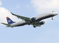 N946UW @ PHL - Brand new E-190 on short final for rw 27R.