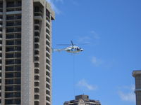 N807PH - N807PH lifts air conditioning units up the side of the Hilton at Waikiki, Honolulu - by Buzz Jackson