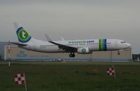 PH-HZM @ AMS - Taken on a gloomy evening at Schipol - by Steve Staunton