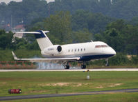 N249AJ @ PDK - Smoking tires on landing. - by Michael Martin