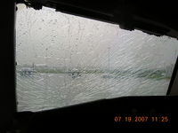 N619UA @ CYUL - Veiw thru captains windshield after divert into CYUL. Aircraft was in cruise at FL270, M.80 approx 100nm north of YUL when outer pane shattered. Ferry to Kabul continued next day after replacement. - by John J. Boling