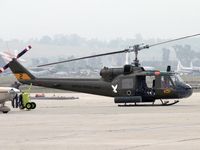 N832M @ RIV - Very nice Huey - by John Meneely