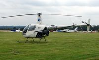 G-BZYE @ EGTR - Robinson R22 Beta