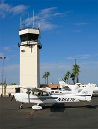 N3547H @ FFZ - Cessna Skyhawk, N3547H sits in front of the Mesa Falcon field tower after arriving from Glendale, Arizona - by mikkelly@indigo.ie