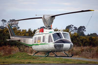 ZK-HSX @ HKK - The evening sun is reflecting on Lakeland Helicopters' Bell UH-1H - by Micha Lueck