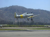 N817TX @ SZP - 1942 North American AT-6D TEXAN 'Problem Child', P&W R-1340 600 Hp, gear coming up over Rwy 22 - by Doug Robertson