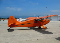 N8306K @ WVI - Locally-based bright orange 1946 Stinson 108 glowing in the sun @ Watsonville, CA airshow - by Steve Nation