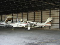 N2127D @ KFCM - Parked inside the Thunderbird Aviation Hangar. - by Mitch Sando