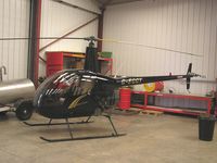 G-EGGY - R22 in the hangar at Wellesbourne - by Simon Palmer