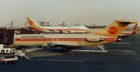 N517PE @ EWR - This CO 727-232, seen in 1987, wears a hybrid scheme, revealing its previous PeoplExpress identity.  This aircraft was originally delivered to Delta in 1973 and was serving Allego in 2006 as XA-ABL. - by Daniel L. Berek