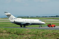 G-JMAX @ EGCC - Hawker 800XP - Under Tow - by David Burrell