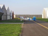 N63KB @ KLVN - Parked infront of it's hangar. - by Mitch Sando