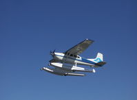 N53092 @ LHD - 1974 Cessna A185F with amphibious floats, Continental IO-520-D 300 Hp, takeoff climb - by Doug Robertson