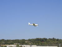 N690CD @ KSTP - Landing Runway 14. - by Mitch Sando