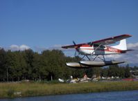 N4057Y @ LHD - 1961 Cessna 185A SKYWAGON, Continental IO-470-F 260 Hp, landing - by Doug Robertson