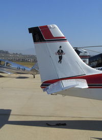 N8964M @ CMA - 1963 Beech 35 B33 DEBONAIR, Continental IO-470-K 225 Hp, Mr. Debonair's tail art - by Doug Robertson