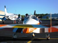 N99932 @ DLZ - Squeezing in for the ride home after the Delaware, OH fly-in breakfast where they feed you 'till you hurt.