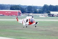 1459 @ DPA - HH-52A hovering for photo from control tower
