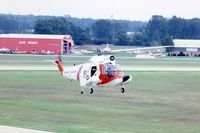 1459 @ DPA - HH-52A hovering for photo from control tower - by Glenn E. Chatfield