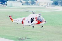 1459 @ DPA - HH-52A hovering for photo from control tower - by Glenn E. Chatfield